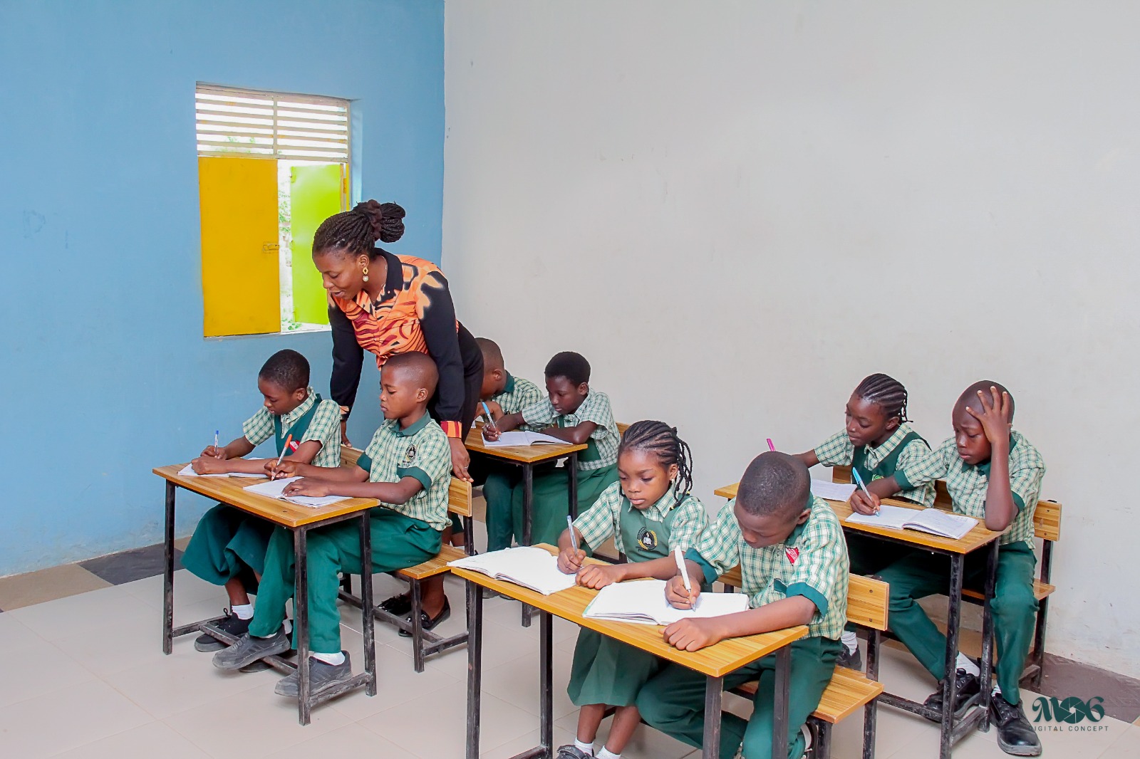 Teacher guiding learners in class